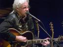 Photo of Arlo Guthrie in concert at the Colonial Theatre, Pittsfield, MA.
